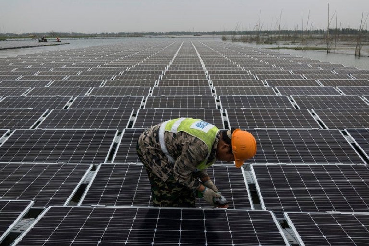 Installer at work on a rooftop solar plant