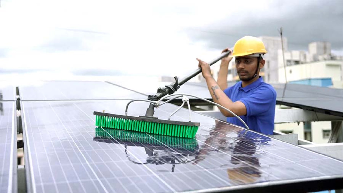 Technician servicing a home solar system